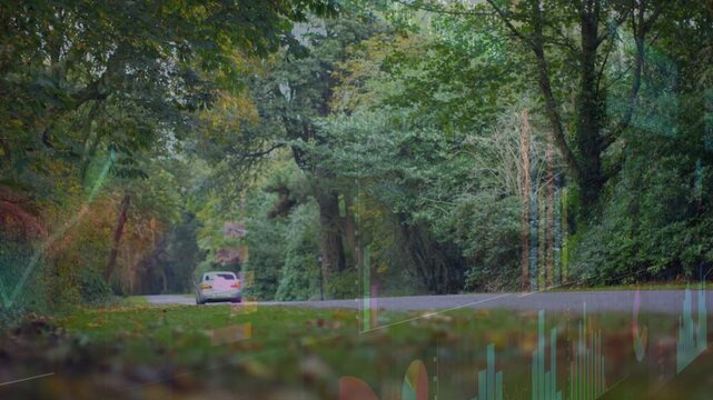 Entering from right edge, silver sedan traveling along country road, showing waveform overlay
