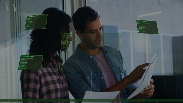 Man pointing and reviewing document, starting HUD boxes popping around faces and paper in office