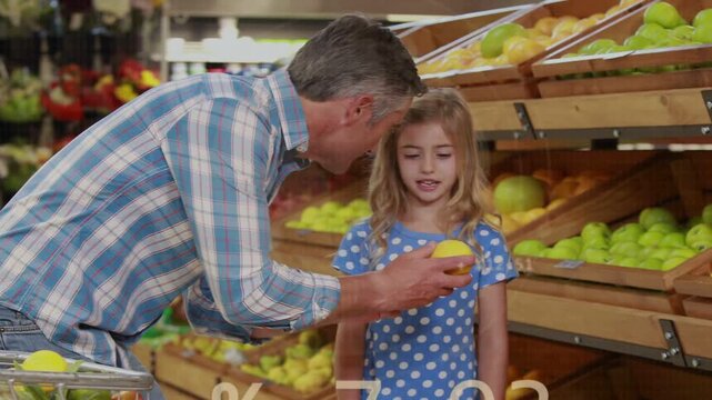 Reaching man in plaid picking lemon as cart sitting beside bins offering girl with data overlays