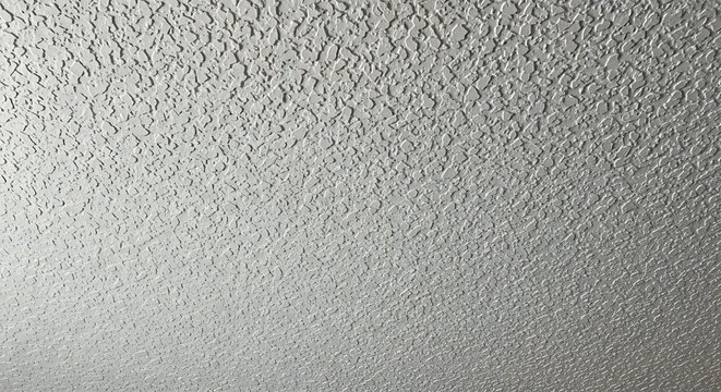 Close up view of white popcorn ceiling texture background.