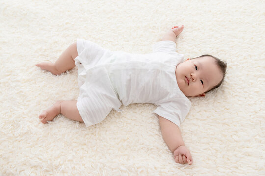 Cute Chinese baby on Bed 