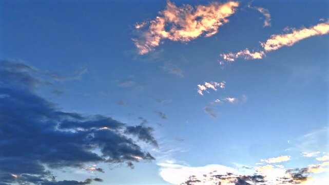 A hyperlapse sequence capturing the richly layered sky at dusk. Clean copy space in the center makes this ideal for title cards, presentations, and promotional overlays.
