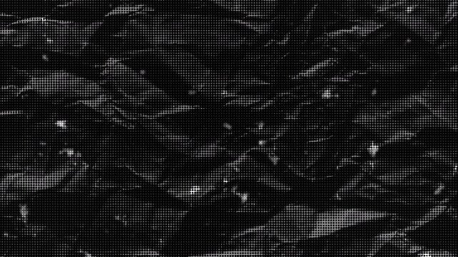 Abstract black and white grunge halftone dots with dust effect video background seamless loop.