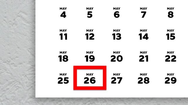 The date May 26th marked with a red cursor on the wall calendar 2026