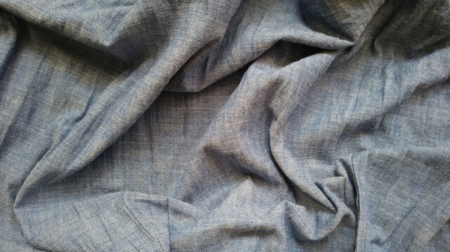 Close-Up of Crumpled Light Blue Denim Fabric