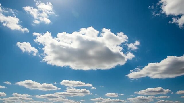 A beautiful, bright and sunny day with fluffy white clouds in a vibrant blue sky