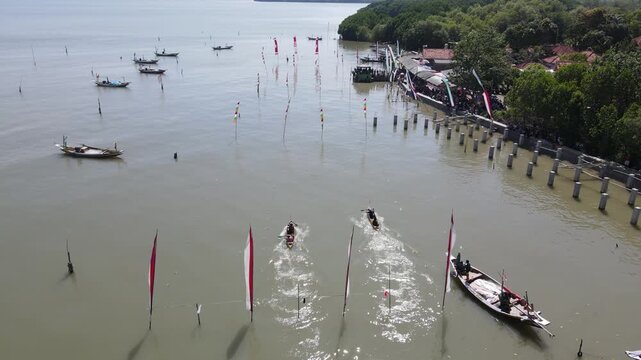 Traditional Wooden Boat Racing Competition in Coastal Village