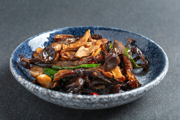 Fototapeta premium Stir-fried pork with Fried Chicken Mushroom