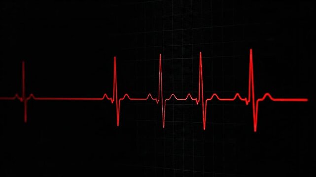 A red line graph showing a heartbeat rhythm on a black background, close up view