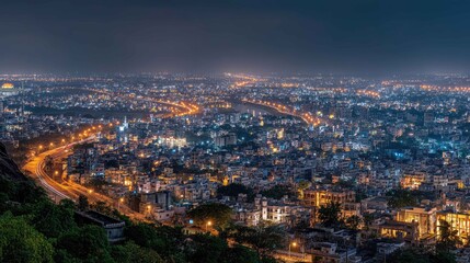Naklejka premium Scenic Night View of Urban City Landscape with Illuminated Streets