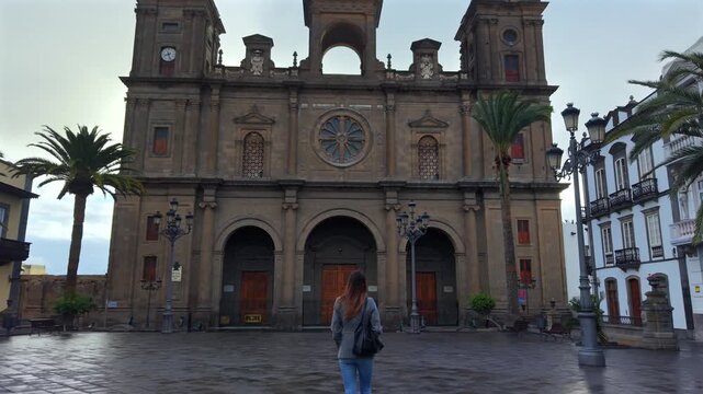 Female tourist visiting the famous Cathedral of Santa Ana in Las Palmas de Gran Canaria, Spain