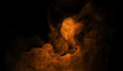 Fototapeta premium powder explosion, brown sand dust, and smoke rising on black background. abstract smoke vapor form for cinematic composition design, fire energy motion. glowing atmospheric texture for visual effects