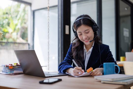 Smiling woman providing online customer support service