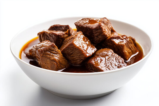 Braised beef chunks in rich sauce served in bowl savory meat dish isolated on white background
