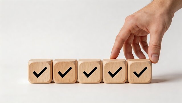 Business man businessman or manager placing wooden cubes with check marks success achievements completed work checklist positive feedback and customer satisfaction hand white