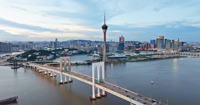 Aerial view of Macau Tower and Sai Van Bridge against the city skyline, Macau, China