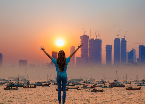 Air pollution concept - Modern highrise rich buildings and poor slums at sunset - Mumbai, india 