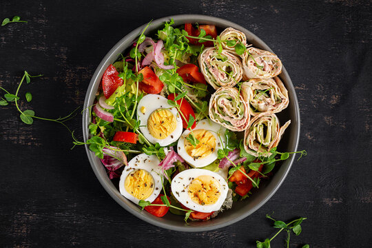 High protein keto meal with lavash rolls cream cheese tuna and salad. Top view, close up