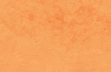 Fototapeta premium Orange swirly plaster texture surface with artistic circular patterns for vibrant interior wall background.