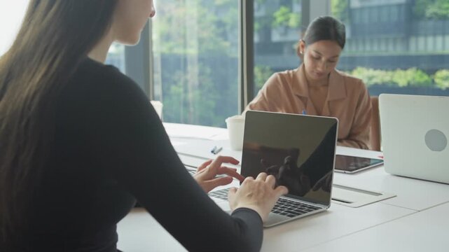 Collaborative work session modern office professional meeting urban environment focused viewpoint team dynamics for productivity