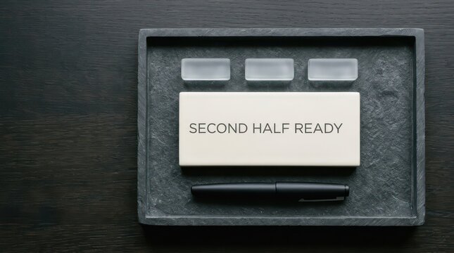 Second Half Ready business header with ceramic title block frosted markers and matte pen on dark tray top view copy space