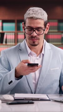 Lawyer Making Photo Of Document With Mobile Phone