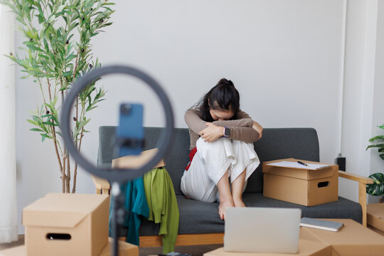 Young asian woman feeling depressed and stressed about online business failure