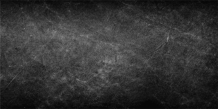 A dark and empty black grunge background features an old textured stone wall pattern with a dirty vintage grey concrete surface for a blank wallpaper design