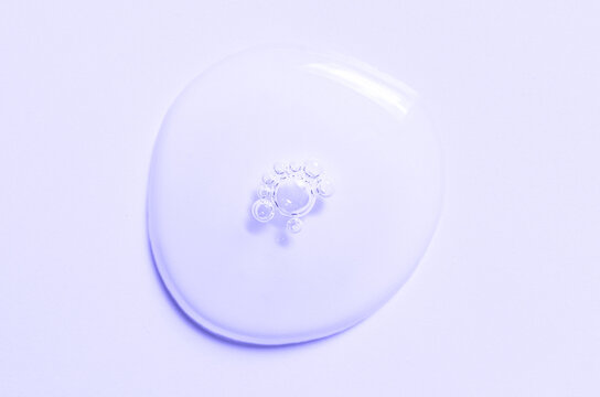 Cosmetic product in the form of a transparent drop. A moisturizing gel or serum for the face.