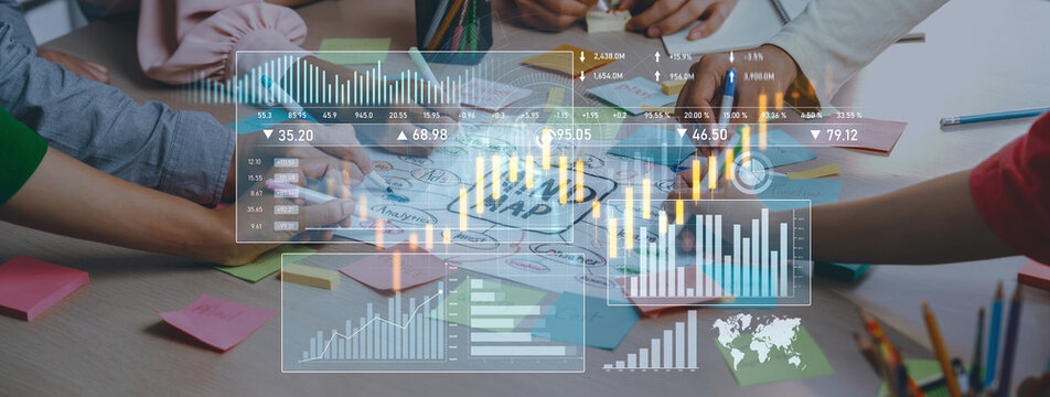 A dynamic team engages in a collaborative brainstorming session, utilizing colorful sticky notes and data visualization tools to develop effective business strategies. Scalp