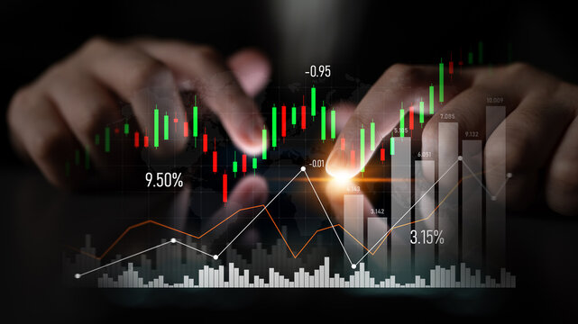 A close-up view of hands interacting with financial data showing stock market trends and analytics, capturing the essence of modern investment strategies and digital analysis. Scalp