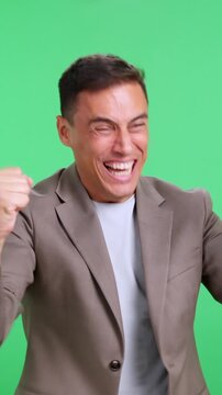 Businessman celebrating a mistake on green screen
