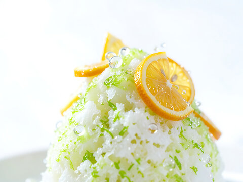 fresh citrus shaved ice with orange lemon slices and sparkling droplets dynamic composition with airy bright background 