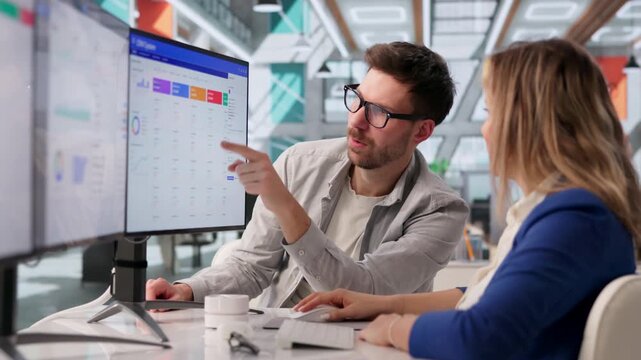 Software Developer Discussing CRM Features During Meeting