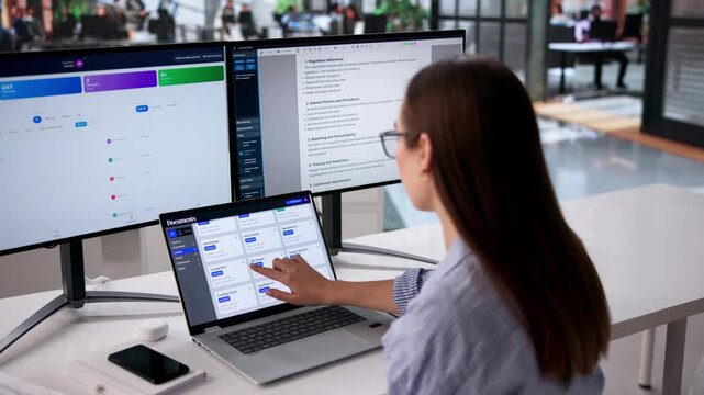 Young Female Office Manager Efficiently Organizing Documents