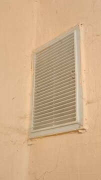 Ventilation grille on the wall with cobwebs in the bathroom. Hood, ventilation system in the house, bathroom