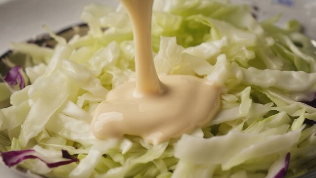 Creamy Dressing Over Green Cabbage Salad