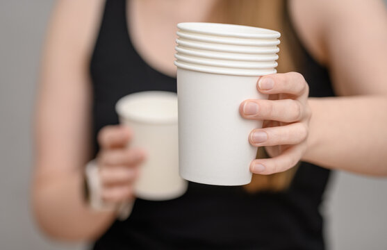 Disposable beverage packaging, several empty coated paper cups for coffee and tea