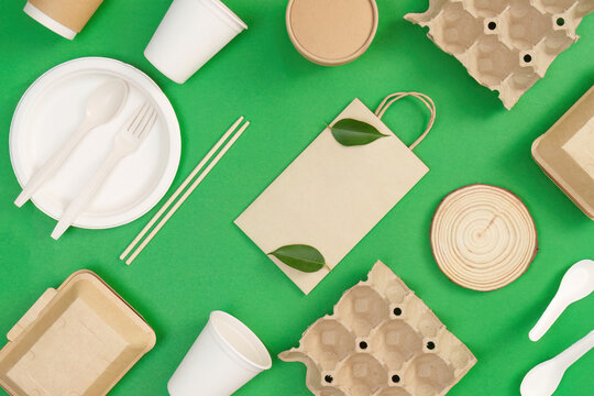 Eco friendly packaging materials on green background