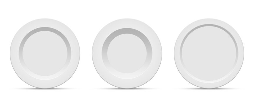 Three pristine white plates with simple, elegant designs stand side-by-side