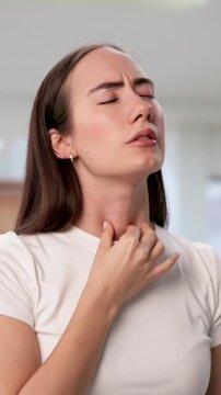 Young Woman Gently Touches Her Neck