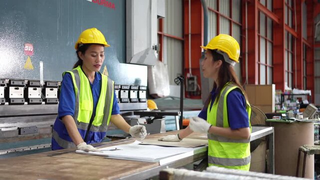 Collaborative teamwork in manufacturing facility workshop setting process documentation industrial environment focused perspective