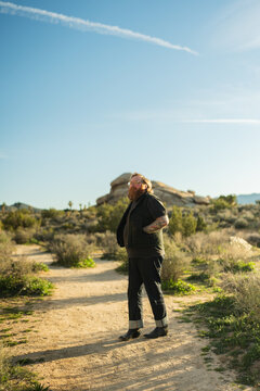 Ginger man with tattoos in Joshua Tree