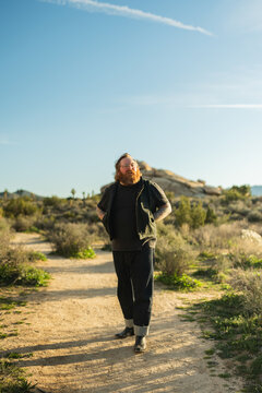 Ginger man with tattoos in Joshua Tree