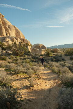 70 year old woman walking through Hall of Horror at Joshua Tree