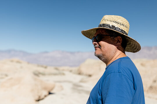 50 Year Old Mexican Man Wearing Hat in Desert on Sunny Day in CA