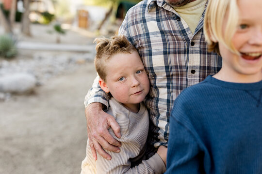 Seven Year Old Boy Holding on to Dad in Borrego Springs, CA