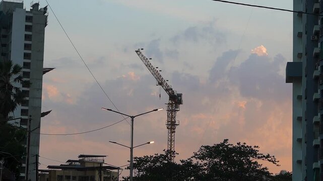Mumbai, India - 22 March 2026: Construction work in progress with cranes at a building site. Building Construction Site Urban Development