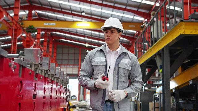 Industrial worker performing safety checks in manufacturing facility workshop environment action shots