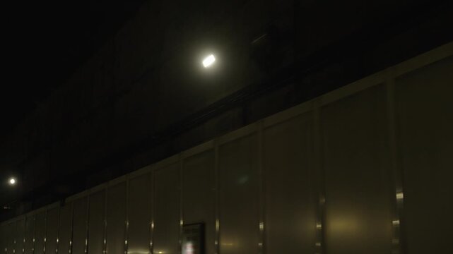 Tunnel wall and ceiling lights moving perspective night driving urban infrastructure scene